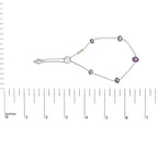 Necklace with pink beads and a white pearl on a white background with a measurement scale.