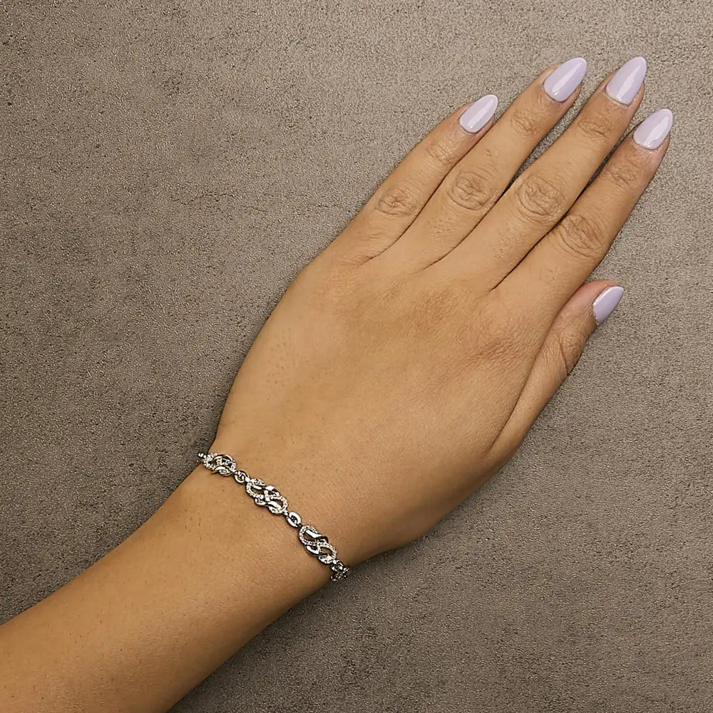 1.0 cttw diamond infinity swirl link bracelet in.925 sterling silver bijoux-nyc direct