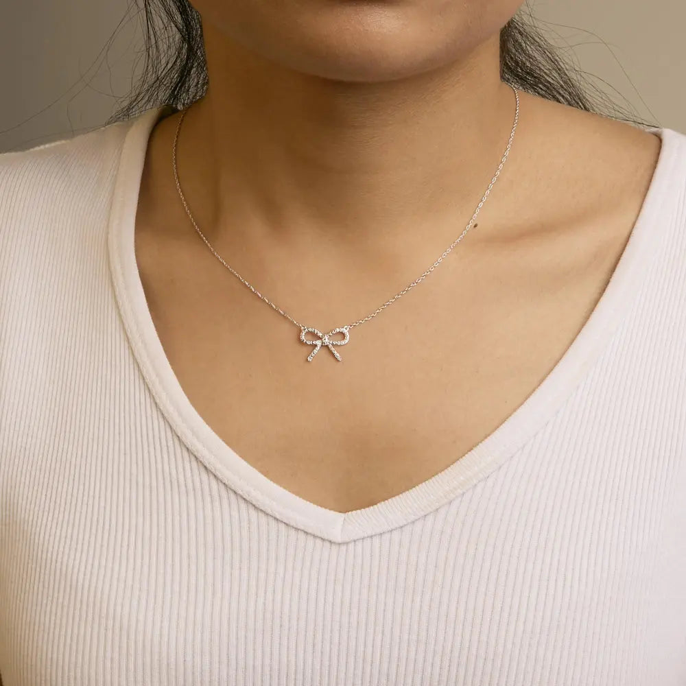 .925 Sterling Silver Diamond Accent Ribbon Bow Knot Pendant Necklace (J-K Color, I2-I3 Clarity) - 18" Inches - Bijoux-NYC Direct