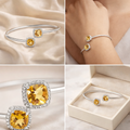 Collage of silver jewelry with yellow gemstones on a soft beige background