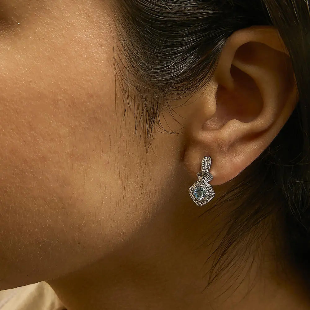 Cushion cut blue topaz and diamond twist dangle earrings in sterling silver bijoux-nyc direct