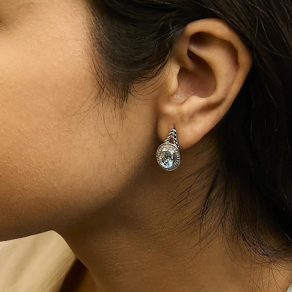 Oval blue topaz and diamond halo twist drop earrings in sterling silver bijoux-nyc direct