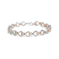 Diamond infinity and swirl link bracelet in 10k two tone gold 1/4 cttw bijoux-nyc direct