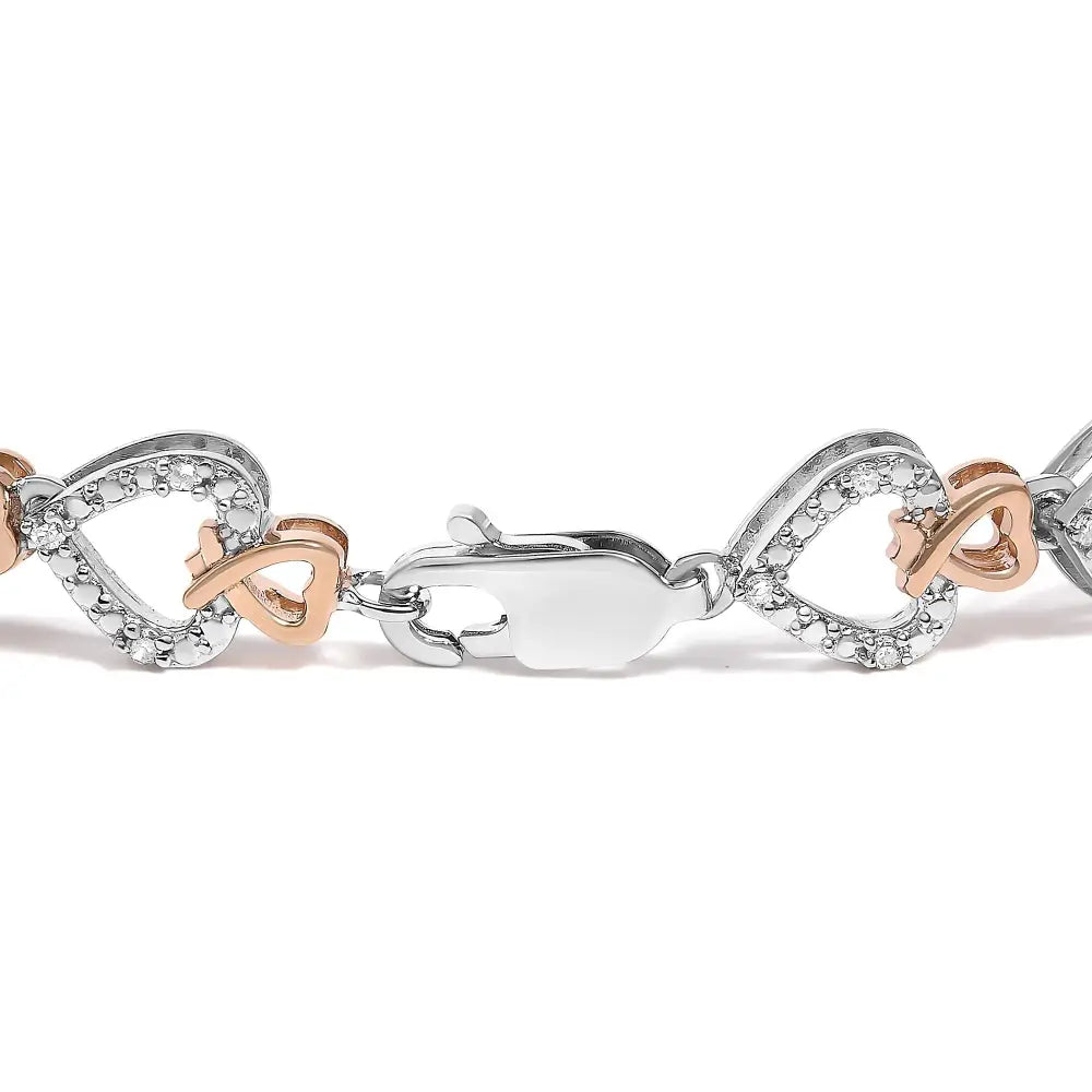 Diamond infinity and swirl link bracelet in 10k two tone gold 1/4 cttw bijoux-nyc direct