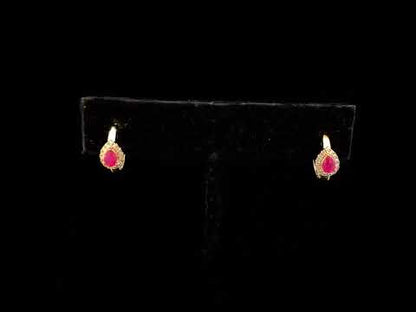 10K Yellow Gold Pear Cut Red Ruby 4x3 mm and 1/10 Cttw Round Diamond Huggy Earrings (I-J Color, I1-I2 Clarity)