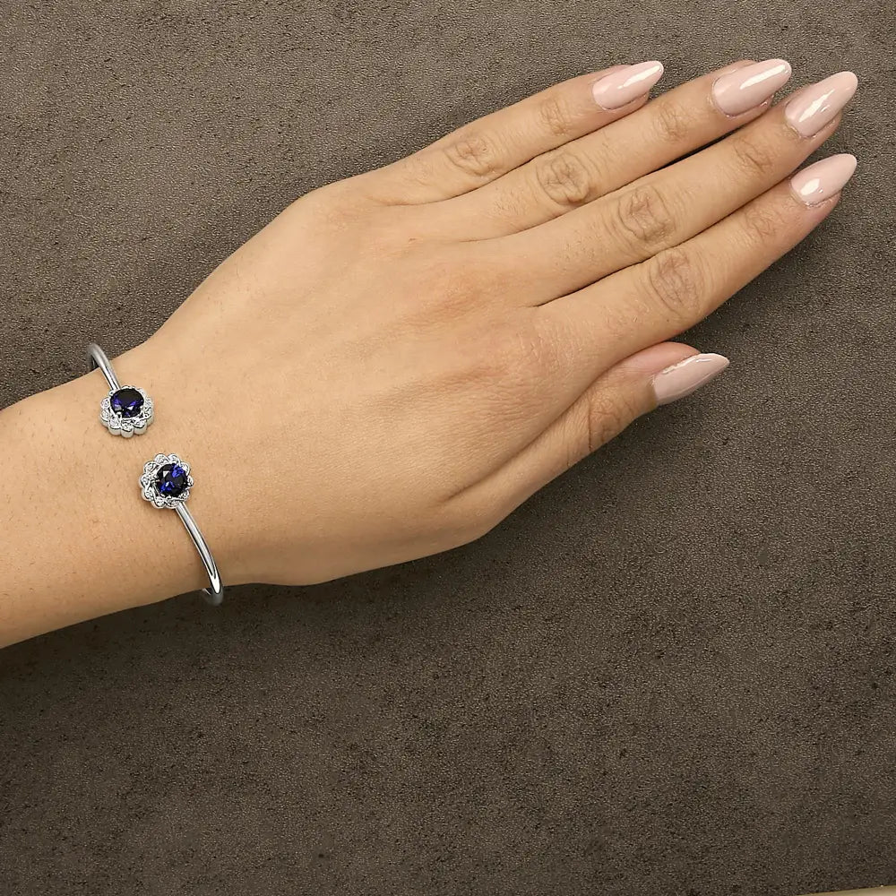Sterling silver created blue sapphire and diamond floral bangle bracelet bijoux-nyc direct